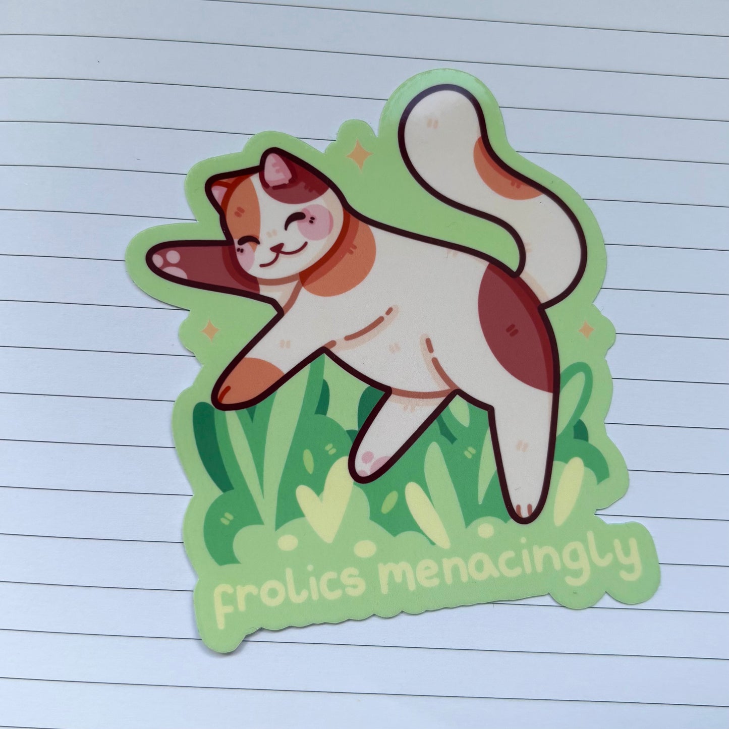 Frolics Menacingly Calico Cat