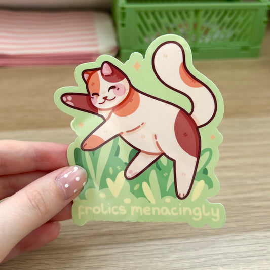 Frolics Menacingly Calico Cat