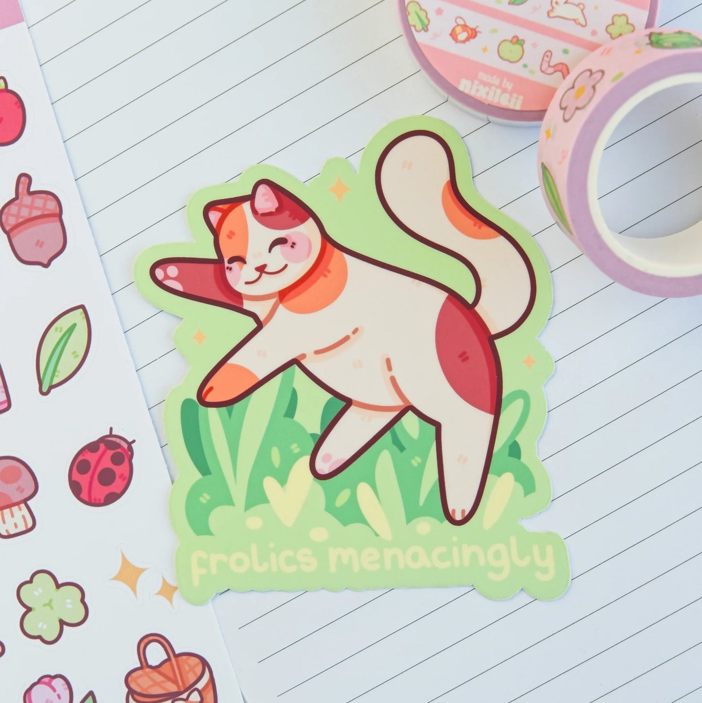 Frolics Menacingly Calico Cat